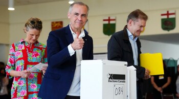 Canada's new Prime Minister and Liberal Leader Mark Carney votes with his wife Diana Fox Carney in Ottawa, Ontario.