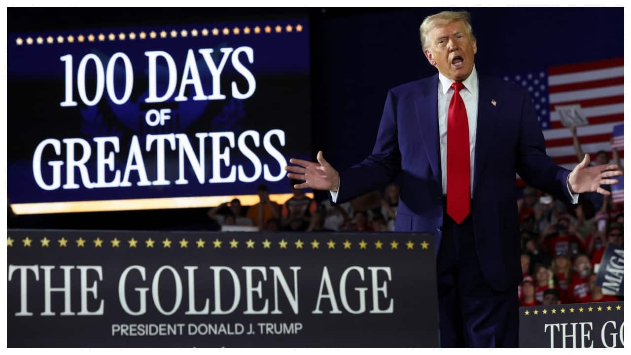 Donald Trump bashes Jerome Powell, touts tariffs at rally marking 100 days