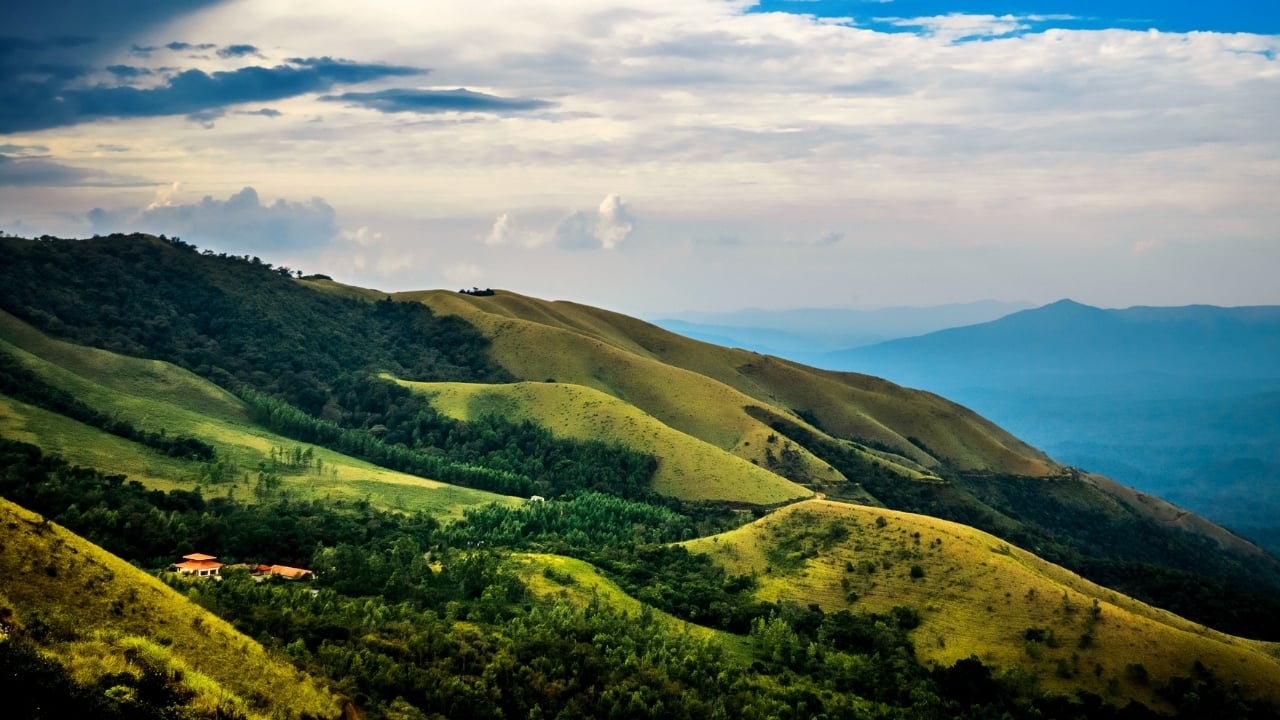 Tucked away in the heart of Karnataka, Chikmagalur is a charming hill station known for its misty mountains, sprawling coffee plantations, and breathtaking landscapes. While it’s no secret that this picturesque town is a haven for nature lovers, there are several hidden gems waiting to be discovered. These offbeat destinations are perfect for travelers seeking an authentic, untouched experience in the lap of nature. Let’s take a journey off the beaten path to uncover 7 of Chikmagalur’s best-kept secrets. (Image: Canva)