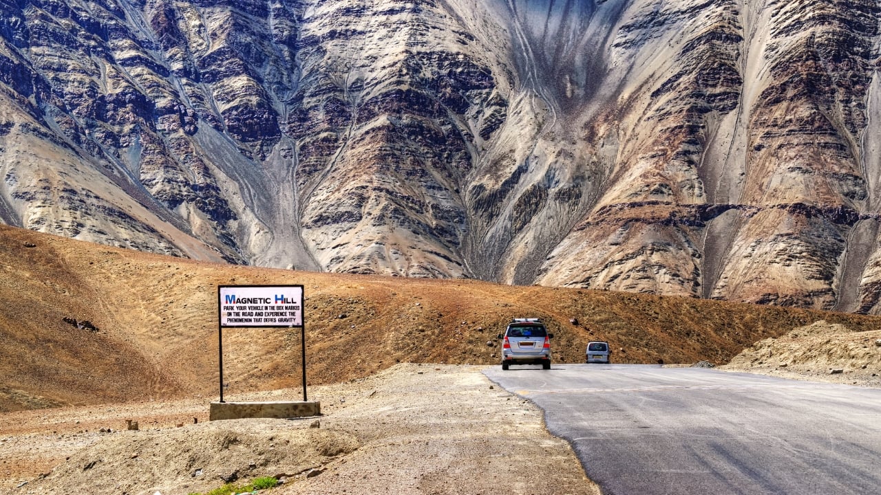 4. Magnetic Hill, Ladakh – The Gravity Hill On the Leh-Kargil-Srinagar highway, travelers can experience a strange optical illusion at Magnetic Hill. Here, vehicles left in neutral gear appear to roll uphill against the force of gravity. While some believe magnetic forces are at play, others argue it’s simply a trick of the landscape. Whatever the cause, Magnetic Hill continues to be one of India’s most mind-boggling natural phenomena, drawing visitors from around the world to witness this seemingly impossible sight. (Image: Canva)