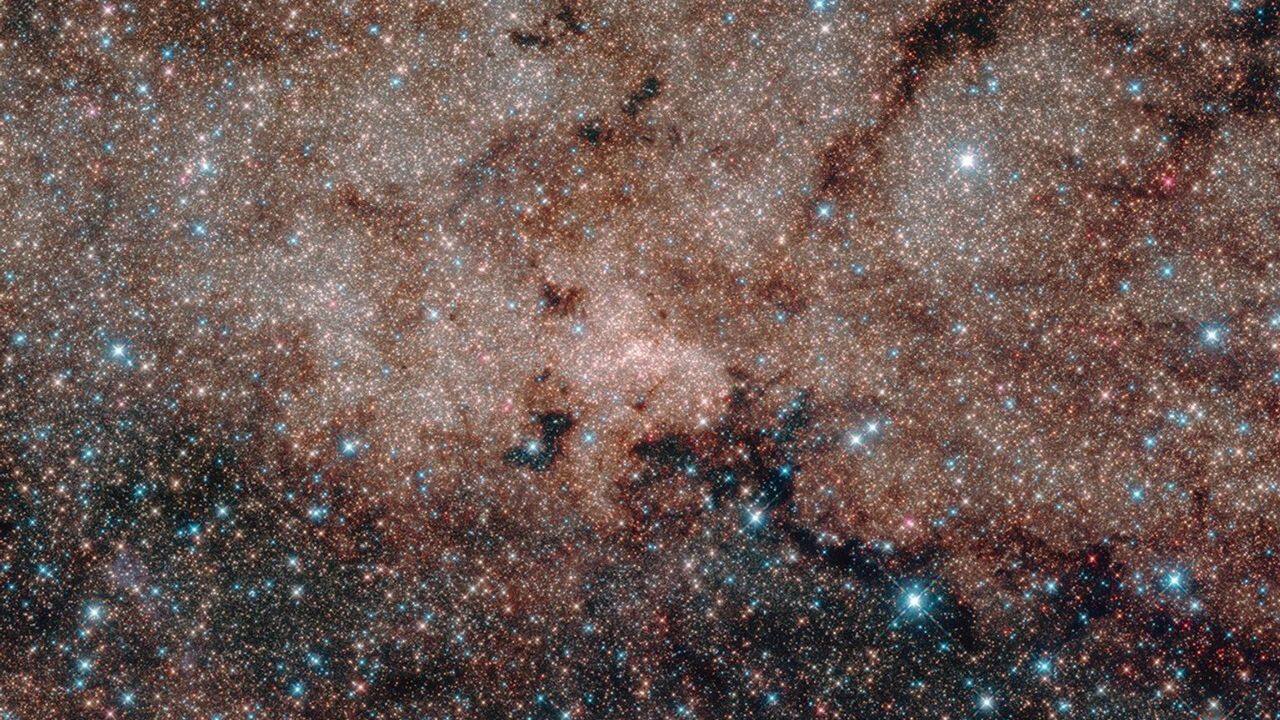 Star Cluster in the Milky Way: A beautiful image of a star cluster in the Milky Way, featuring a collection of stars born together. (Image: NASA)
