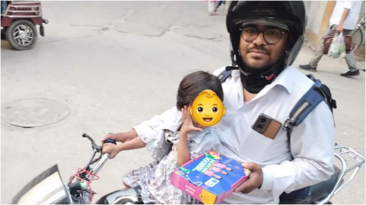 Swiggy delivery agent's dedication shines as he juggles work with toddler daughter. Heartwarming post