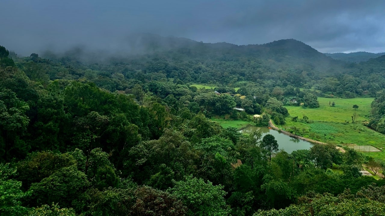 1. Coorg, Karnataka Nestled in the lush Western Ghats, Coorg isn’t just picturesque—it’s a sustainable paradise. Solar-powered homestays, organic coffee farms, and eco-friendly retreats offer an immersive experience for kids to discover farm life and sustainability firsthand. (Image: Canva)