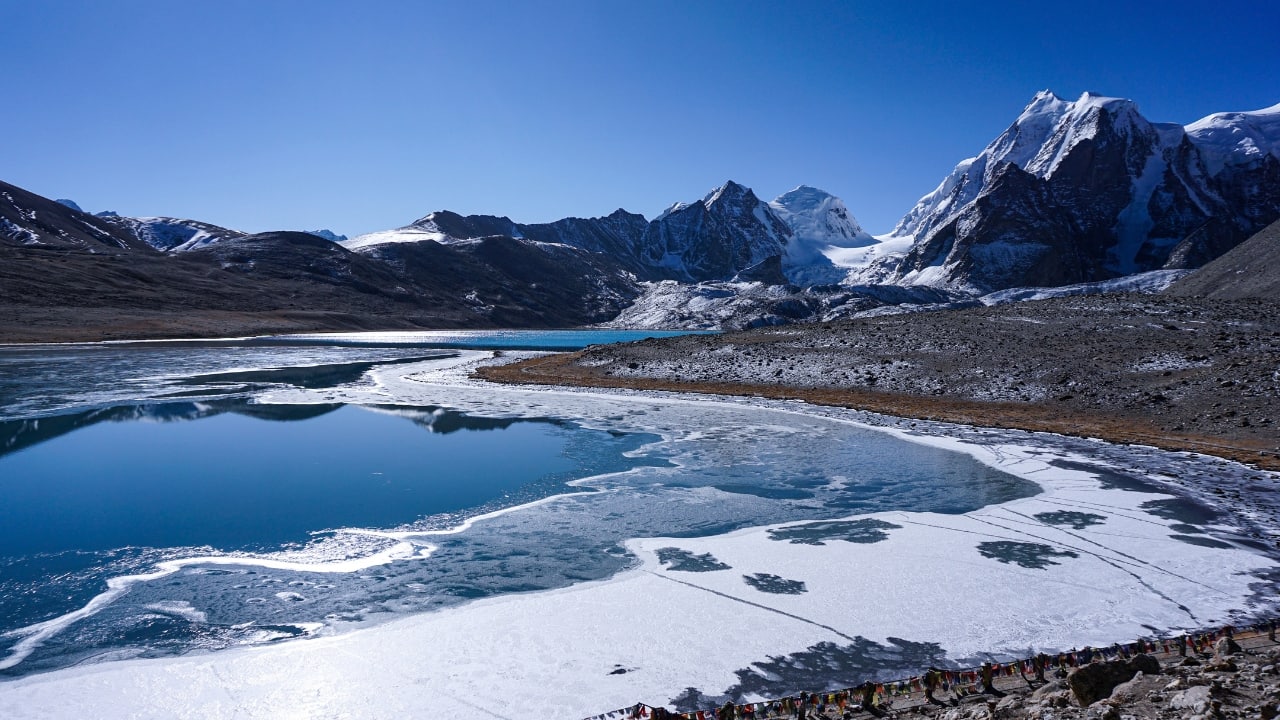 3. Gurudongmar Lake, Sikkim – Spiritual &amp; Surreal One of the highest lakes on Earth at 17,800 feet, Gurudongmar feels otherworldly. Snow-covered peaks, sacred legends, and thin air—this trek is tough, but the payoff is a landscape that looks like it was painted by the gods. (Image: Canva) Best time to visit: April–June Trek difficulty: Moderate