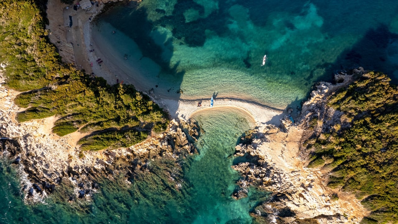 7. Albania – Europe’s Most Underrated Beach Escape Tucked along the Adriatic and Ionian coasts, Albania is a sun-kissed surprise. Its beaches are unspoiled, its towns are storybook pretty, and its mountains are wild and welcoming. You can wander through ancient ruins in Butrint, climb castle walls in Gjirokastër, or just sip espresso by the sea in Sarandë—without the crowds of Europe’s usual hotspots. (Image: Canva)