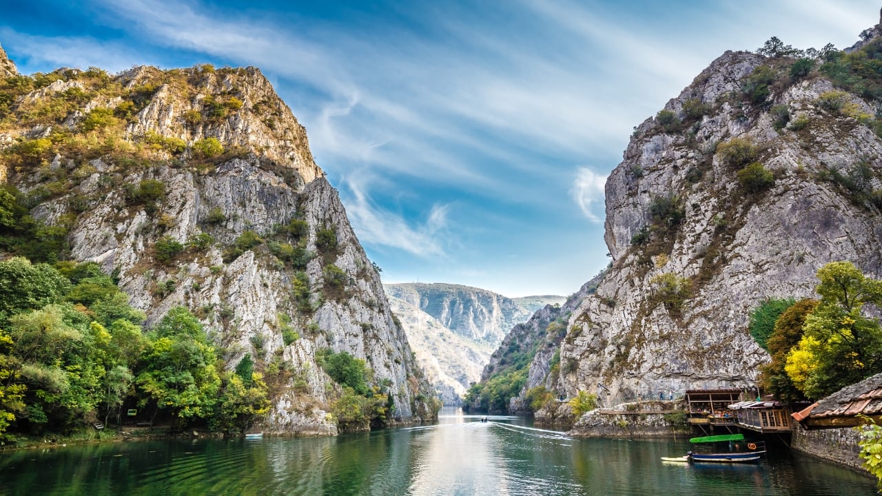 8. North Macedonia – Lakes, Legends &amp; Timeless Streets This Balkan beauty blends the tranquil with the historical. Skopje’s quirky architecture, Byzantine churches, and lakeside cafes set a curious tone, but it’s Lake Ohrid that steals the heart—crystal waters, cobbled lanes, and a peaceful atmosphere that feels untouched by time. It's a place where stories linger in the stones and sunsets seem to last forever. (Image: Canva)