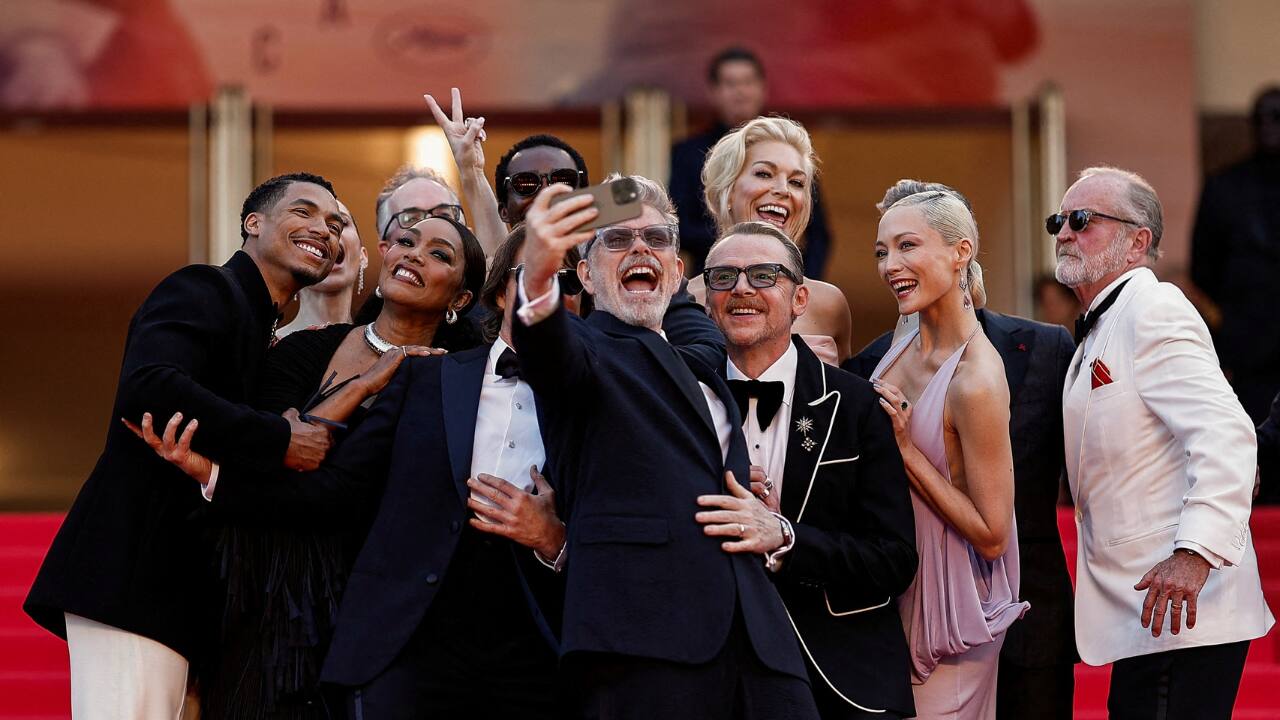 Director Christopher McQuarrie takes a selfie with cast members including Tom Cruise, Hayley Atwell, Tramell Tillman, Simon Pegg, Hannah Waddingham, Greg Tarzan Davis and Angela Bassett, on the red carpet during arrivals for the screening of the film "Mission: Impossible - The Final Reckoning" Out of competition at the 78th Cannes Film Festival in Cannes, France. (Photo: Reuters)