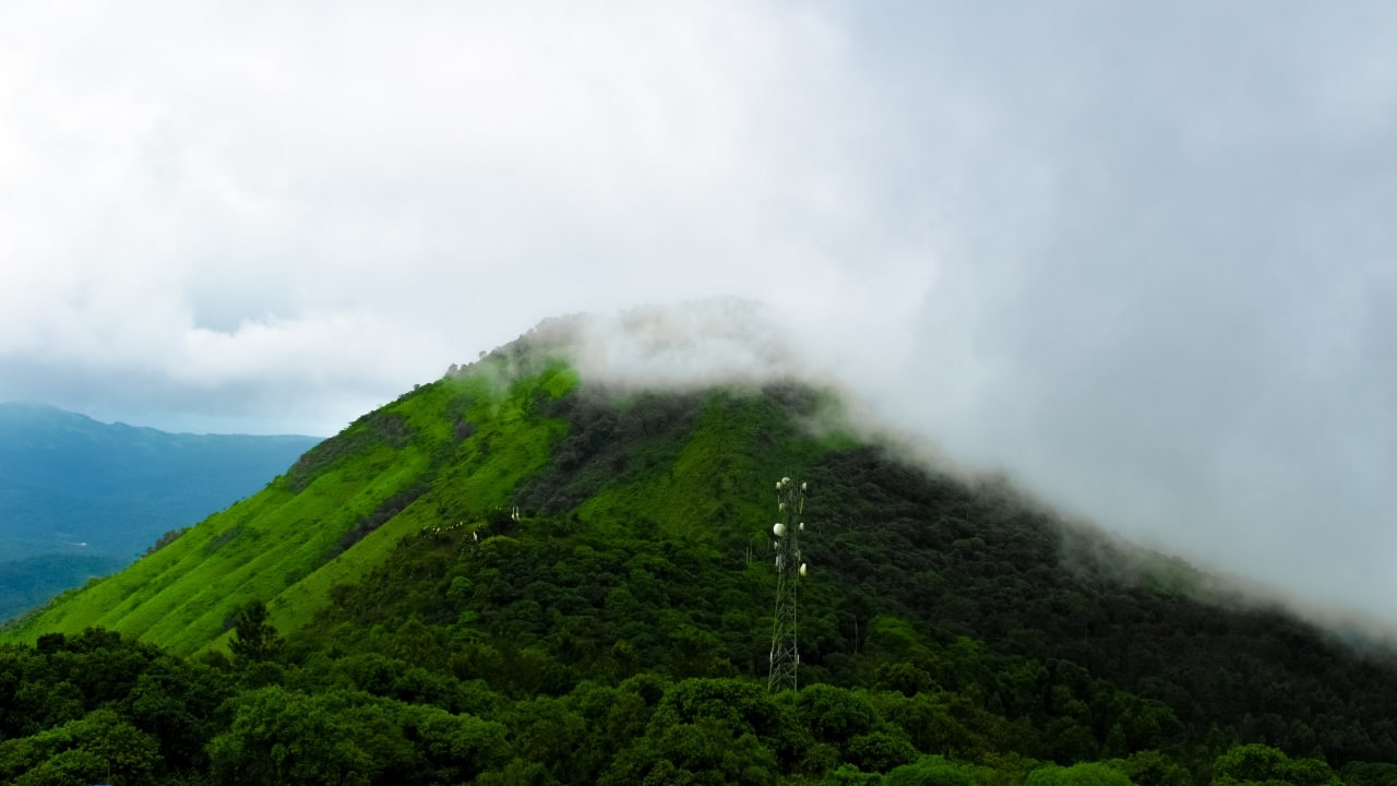 4. Mullayanagiri, Karnataka – Karnataka’s Highest Point This trail near Chikmagalur serves up dramatic vistas with every twist and turn. Rock-hewn paths, ancient caves, and a temple at the summit make it both spiritual and scenic. Best time to visit: September to March (Image: Canva)