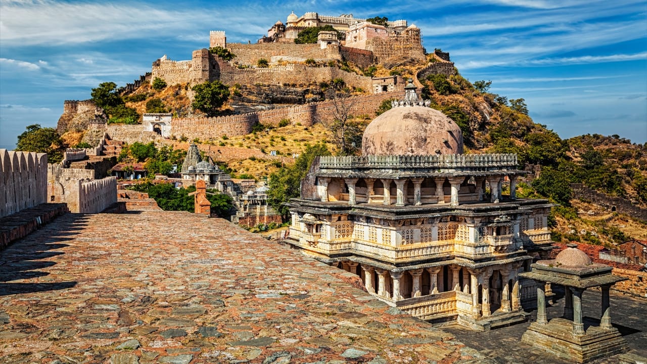 3. Kumbhalgarh Fort, Rajasthan: India’s Great Wall That Repelled All Invaders Stretching over 36 kilometers, Kumbhalgarh’s walls are second only to China’s Great Wall in length. Concealed within the Aravalli hills, it served as a final refuge for Mewar rulers. Its thick ramparts and forested terrain made conquest nearly impossible. The British never dared to storm it. Visit at dusk to catch the light and sound show—an immersive retelling of centuries of valiant defense and royal intrigue. (Image: Canva) 3. Kumbhalgarh Fort, Rajasthan: India’s Great Wall That Repelled All Invaders Stretching over 36 kilometers, Kumbhalgarh’s walls are second only to China’s Great Wall in length. Concealed within the Aravalli hills, it served as a final refuge for Mewar rulers. Its thick ramparts and forested terrain made conquest nearly impossible. The British never dared to storm it. Visit at dusk to catch the light and sound show—an immersive retelling of centuries of valiant defense and royal intrigue. (Image: Canva)