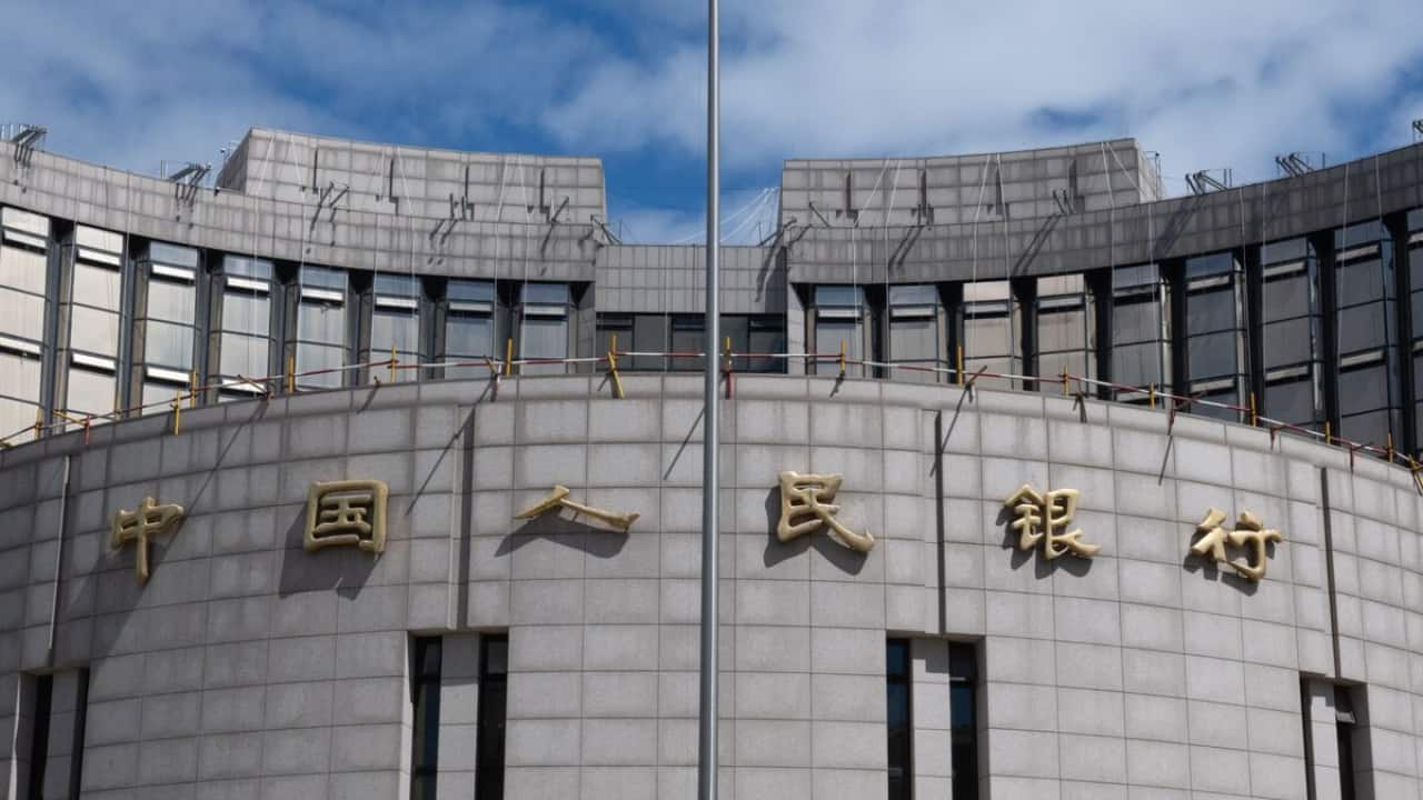 Chinese banks lower benchmark lending rates after easing by PBOC