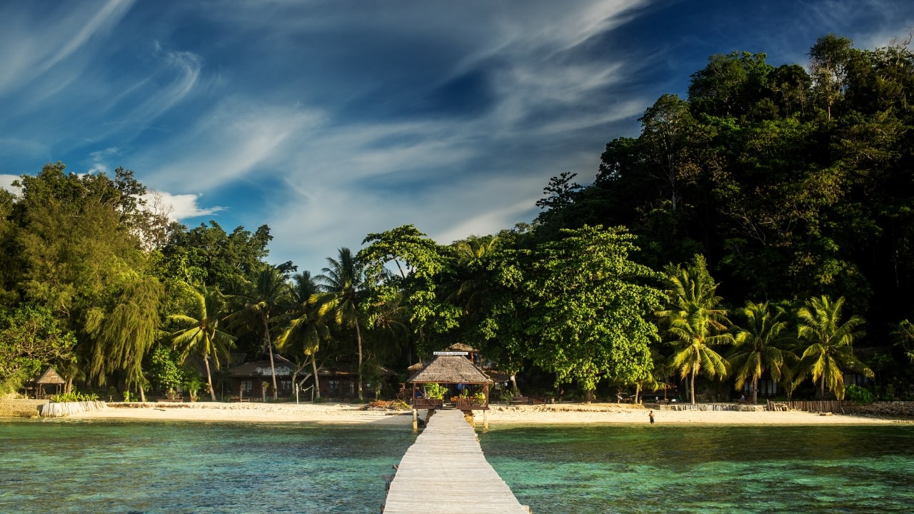 2. Togean Islands, Central Sulawesi Lost in the Gulf of Tomini, this string of isolated isles offers volcanic peaks, stingless jellyfish lakes, and coral reefs as colorful as they are untouched — far from tourist traffic. (Image: Canva)