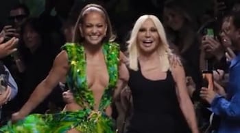 Giving it her own unique twist, she paired the statement dress with understated makeup and a sleek bun, allowing the timeless design to take center stage.