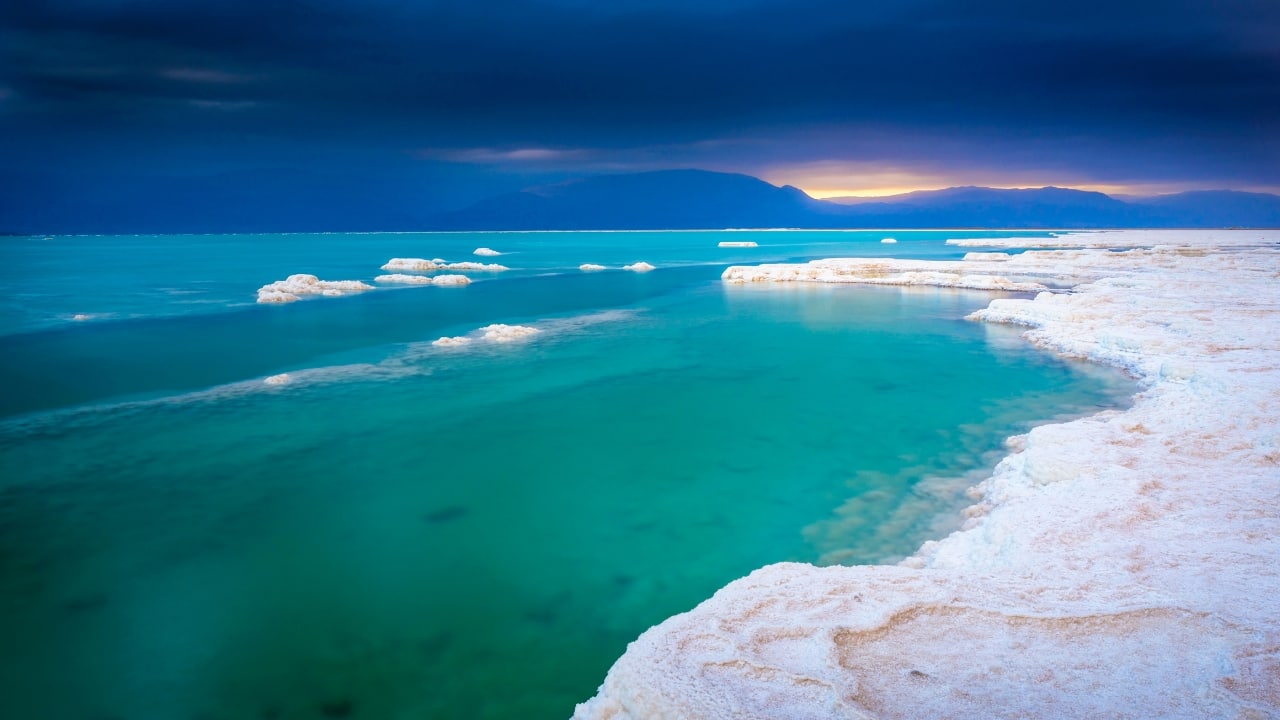 8. The Dead Sea, Israel and Jordan Famous for its buoyant waters and mineral-rich mud, the Dead Sea is shrinking at an alarming pace. Visit this natural wonder soon to float in its salty waters before its shores retreat further. (Image: Canva)