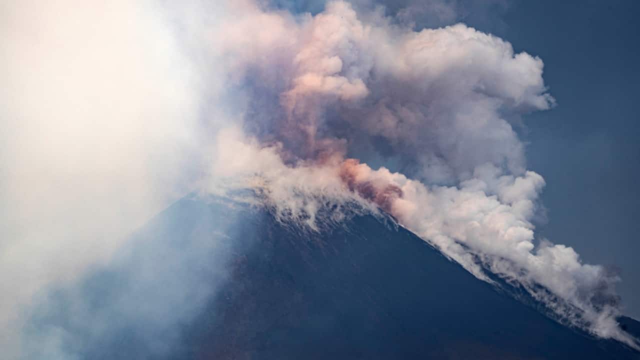 Visuals captured by tourists showed plumes of smoke rising into the sky as rivers of lava flowed down the mountain’s slopes. Some tourists were seen hurrying away from the area, although no injuries or casualties were reported. (Image: AP)