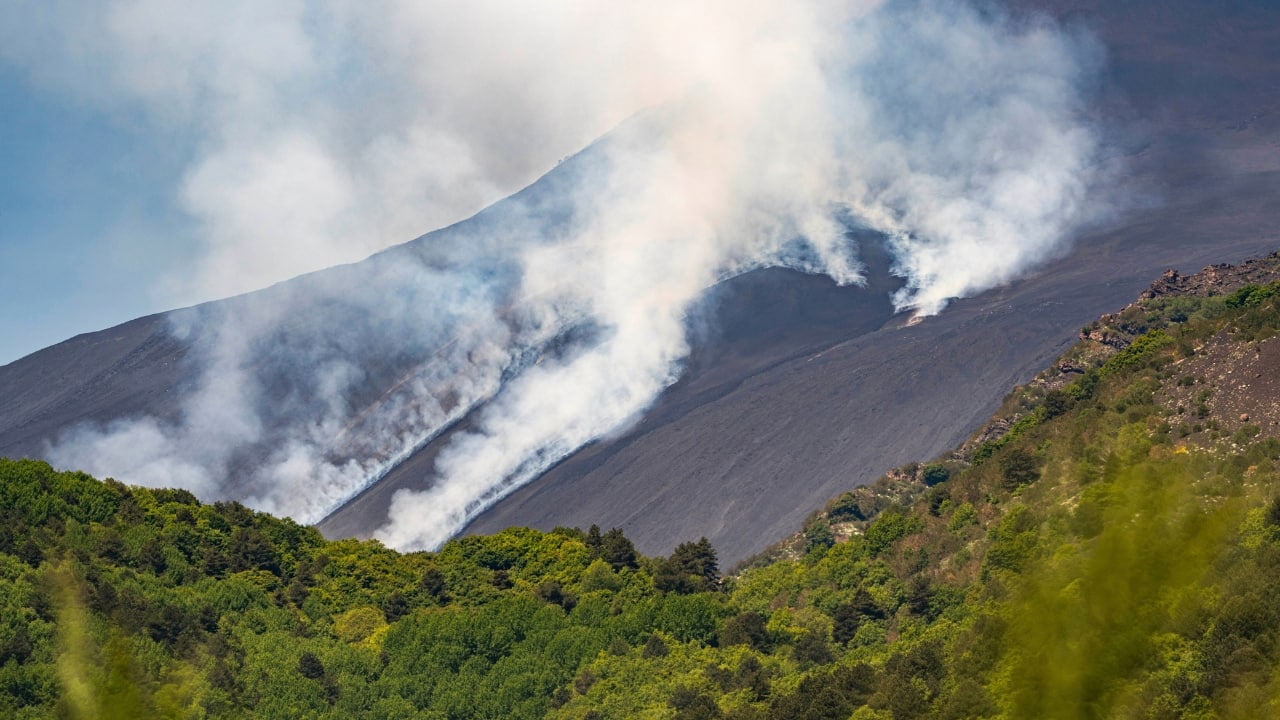 According to Italy’s National Institute of Geophysics and Volcanology (INGV), the eruption was triggered by a partial collapse in the volcano’s southeast crater. The collapse unleashed streams of molten lava and marked Etna’s 14th major activity phase in recent months. (Image: AP)