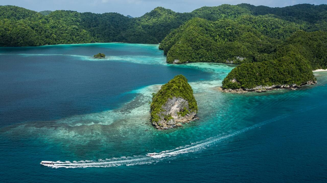 12. Palau – A Small Nation Making a Big Impact Palau has implemented groundbreaking policies like the Plastic Bag Use Reduction Act and zero disposable plastic rules on government properties. Banning open-air plastic waste burning reduces toxic emissions, proving that even small countries can lead on plastic pollution prevention. (Image: Canva)