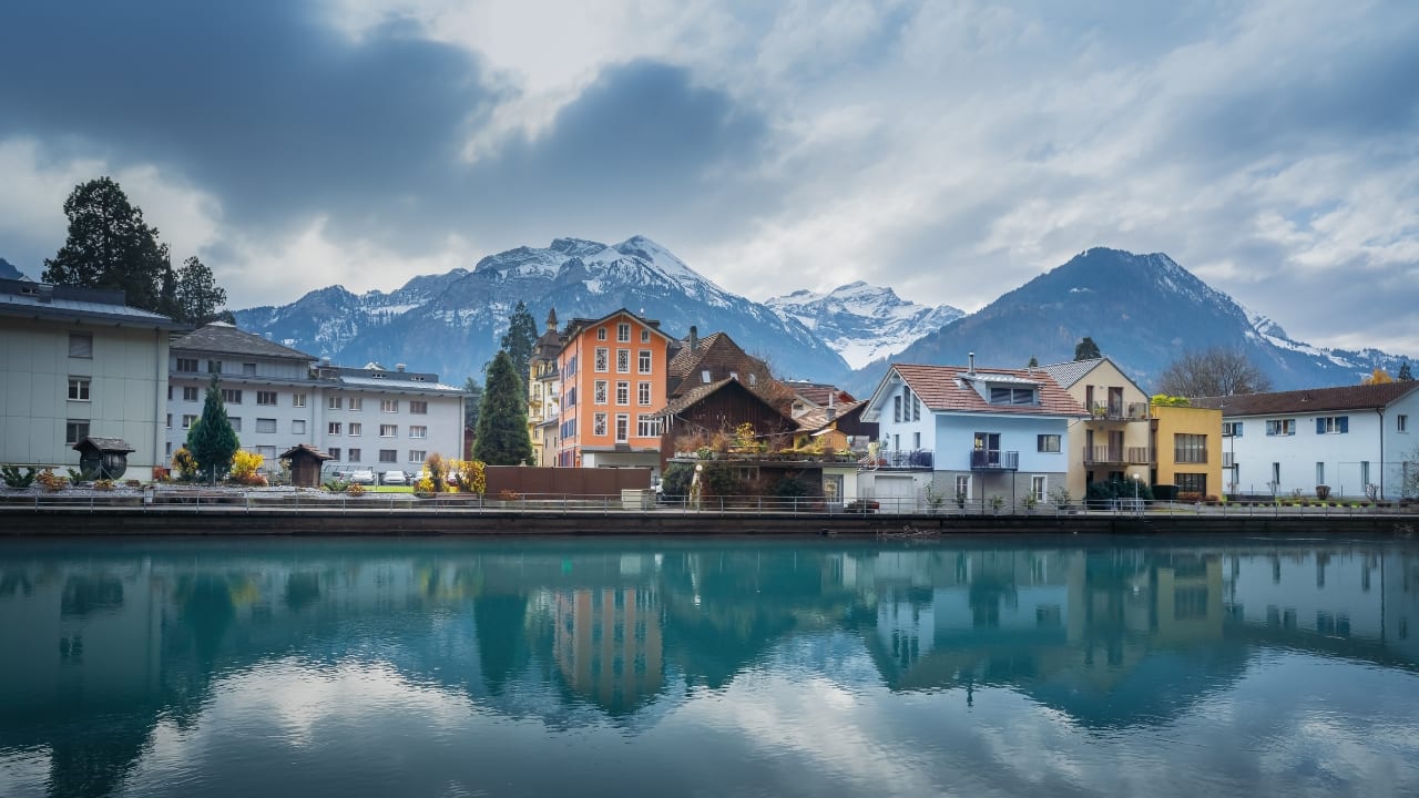 6. Interlaken, Switzerland – Adventure at Every Altitude Between two alpine lakes and surrounded by snow-dusted peaks, Interlaken is a summer playground for thrill-seekers. Hike, paraglide, or ride a cogwheel train—every experience comes with postcard-perfect scenery. (Image: Canva)