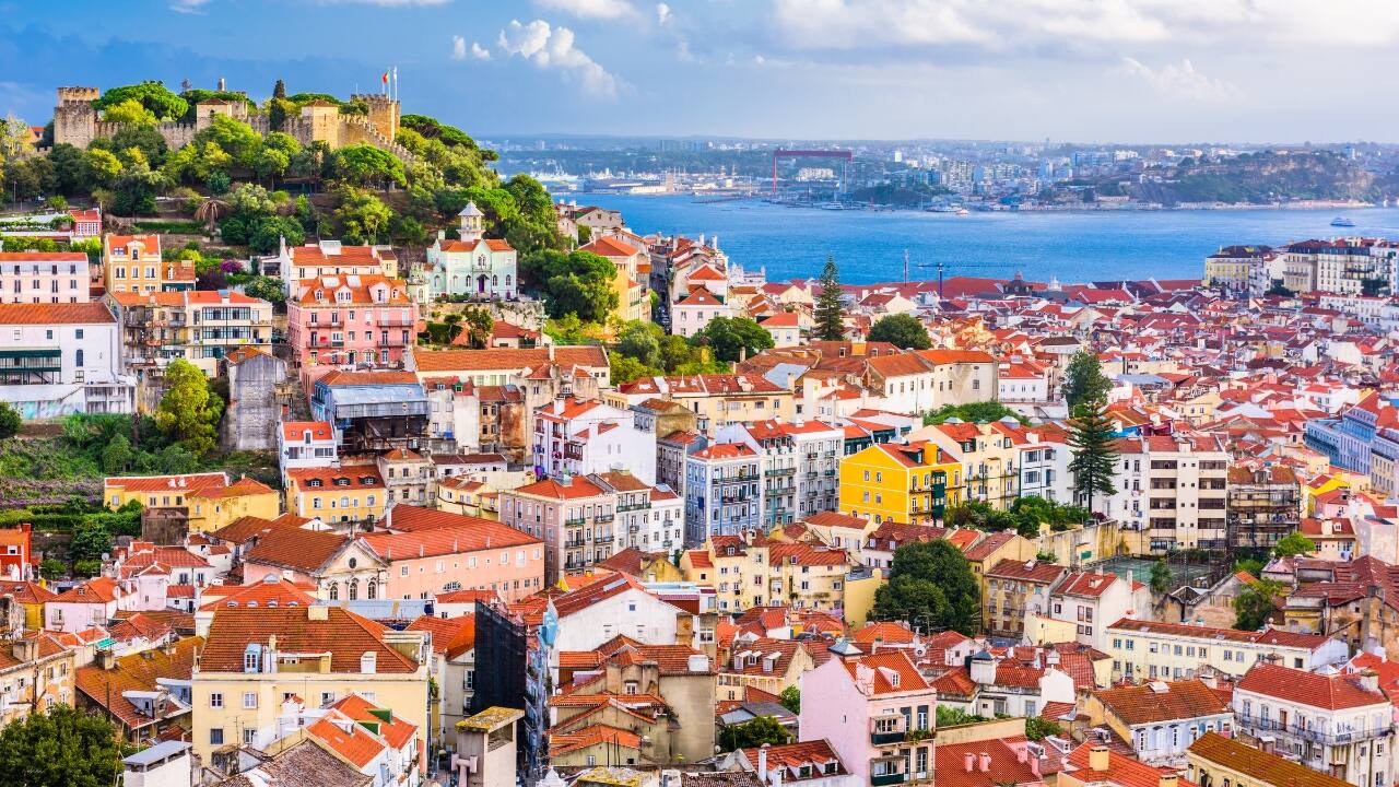 7. Lisbon, Portugal – Europe’s Sunniest Capital with Soul Lisbon hums with soulful music, historic charm, and hilltop views that stretch to the Atlantic. Ride vintage trams, linger over custard tarts, and let the city’s golden light work its magic. (Image: Canva)