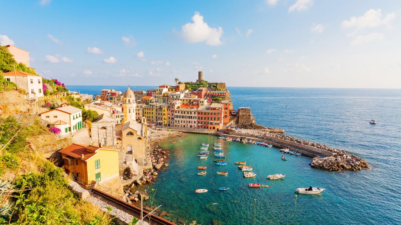 9. Cinque Terre, Italy – Five Villages, Infinite Views Tucked along the Ligurian coast, Cinque Terre is a riot of color and flavor. Walk the cliffside paths linking its five fishing villages, stop for seafood pasta, and swim in secret bays. (Image: Canva)