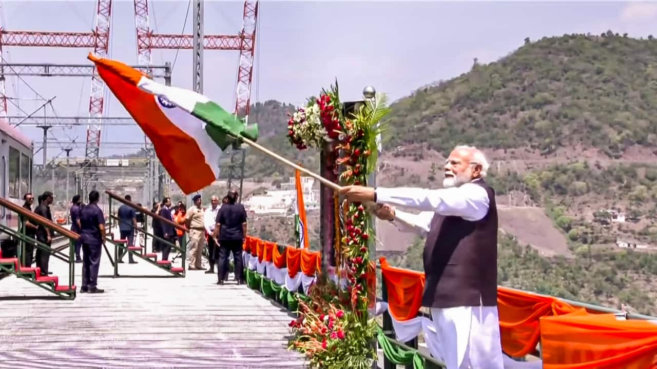 PM Modi Inaugurates Chenab Bridge, Flags Off Vande Bharat in J&amp;K On June 6, 2025, Prime Minister Narendra Modi inaugurated the world’s highest railway arch bridge—the iconic Chenab Railway Bridge—in Jammu and Kashmir’s Reasi district. In a historic push for railway infrastructure in the Union Territory, he also flagged off the Vande Bharat Express from Katra to Srinagar and unveiled the Anji Khad Bridge, India’s first cable-stayed railway bridge. These projects are integral to the Rs 43,780-crore Udhampur-Srinagar-Baramulla Rail Link (USBRL), a strategic national project aimed at bringing the Kashmir Valley onto India’s railway map. (Image: PTI)