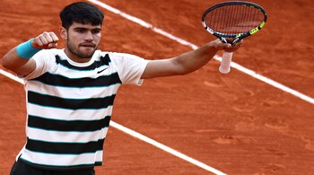 Spain's Carlos Alcaraz reacts after winning the fourth set during his men's singles final match against Italy's Jannik Sinner on day 15 of the French Open tennis tournament on Court Philippe-Chatrier at the Roland-Garros Complex