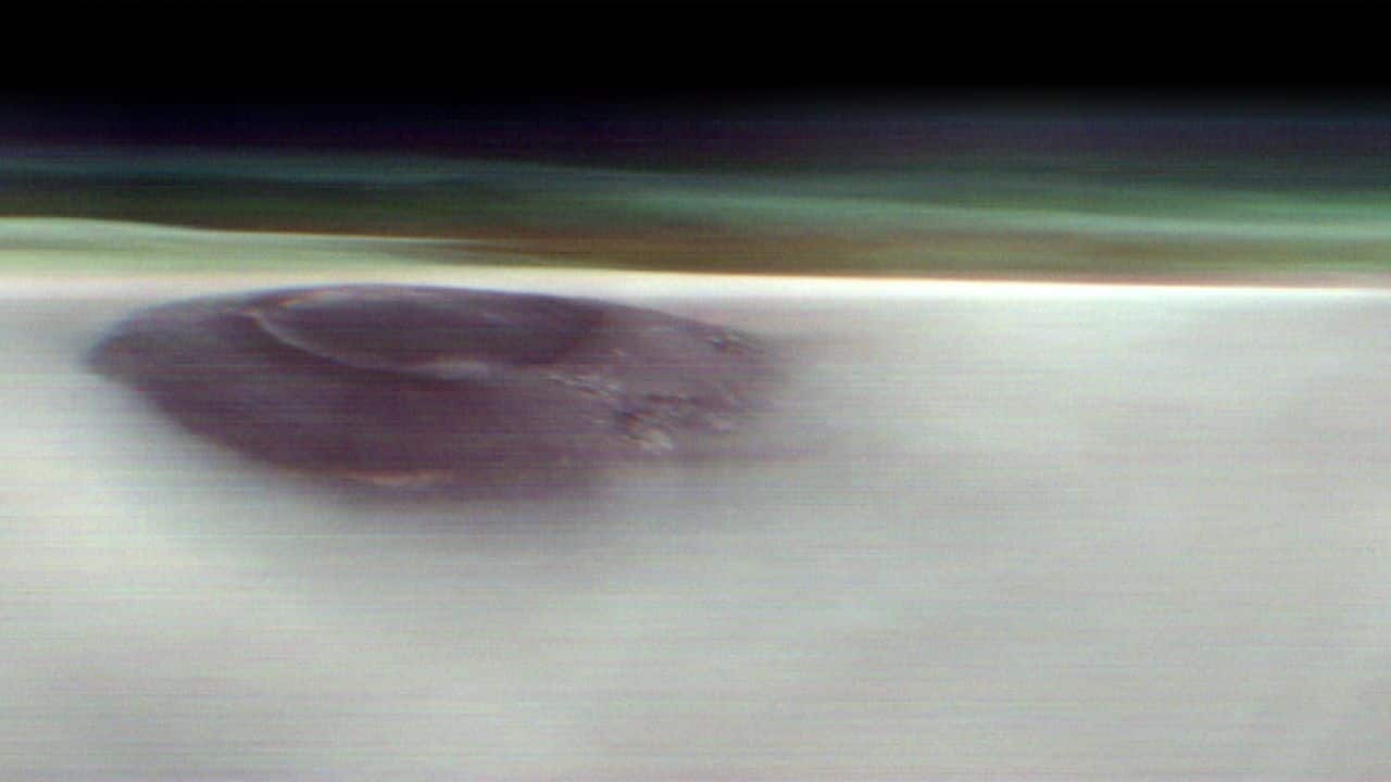 NASA captures giant Mars volcano piercing through morning clouds