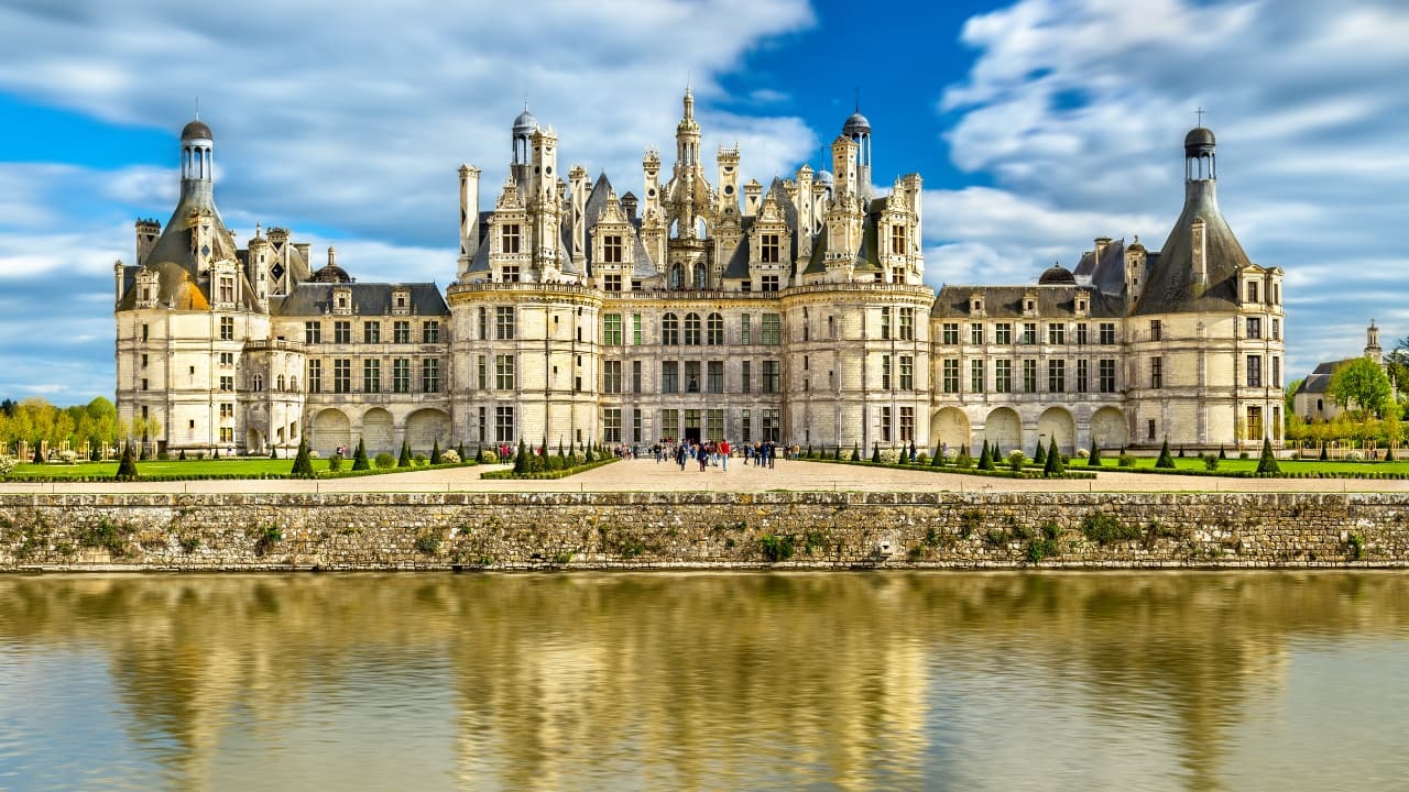 2. Château de Chambord, France With over 400 rooms and an iconic double-helix staircase rumored to be designed by Leonardo da Vinci, Château de Chambord is the crown jewel of the Loire Valley. A symbol of French Renaissance opulence, it’s where symmetry meets splendor on a grand scale. (Image: Canva)