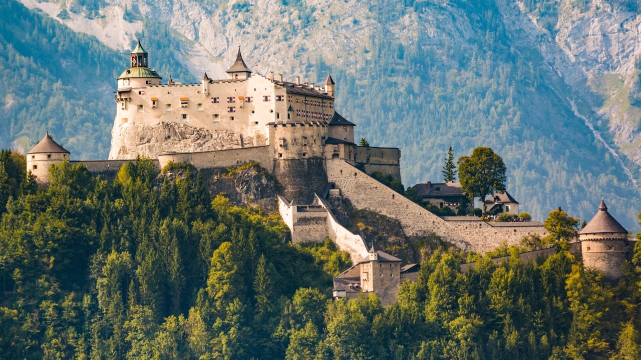 6. Hohenwerfen Castle, Austria Tucked away in the Austrian Alps, Hohenwerfen Castle is the kind of place that makes you look twice. Dating back to the 11th century, it comes complete with falconry shows, ancient armories, and panoramic views of the Salzach Valley. It’s not just a castle — it’s an experience. (Image: Canva)