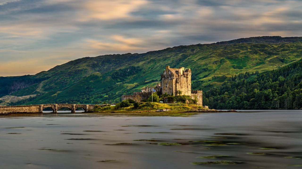 9. Eilean Donan Castle, Scotland Framed by misty lochs and rugged highlands, Eilean Donan is one of Scotland’s most iconic castles. Accessible by a stone bridge and surrounded by natural beauty, it feels cinematic — which explains its frequent appearances in films and travel dreams alike. (Image: Canva)