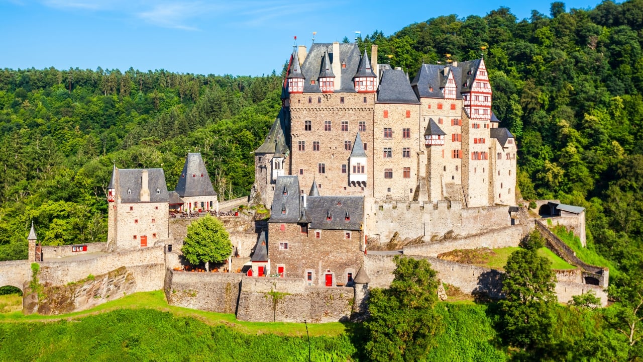 14. Eltz Castle, Germany Hidden in the Moselle Valley forest, Eltz Castle is a rare example of a fortress that has never been destroyed. It has remained in the same family for over 850 years and still feels like a well-kept secret — complete with timbered towers, cobbled courtyards, and priceless heirlooms. (Image: Canva)