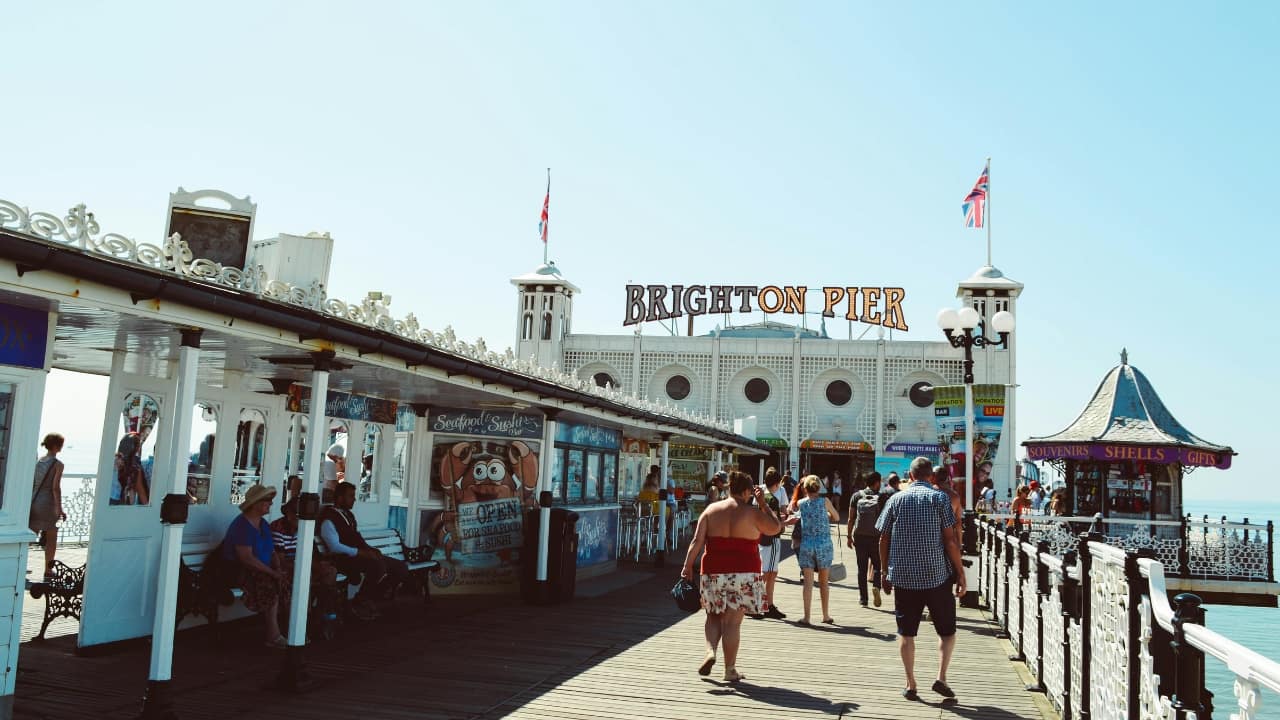 4. Brighton &amp; Hove, UK Brighton &amp; Hove isn’t just LGBTQ+-friendly—it’s downright iconic. Often dubbed the UK’s gay capital, its seaside energy crackles in Kemptown’s rainbow-draped streets, drag brunches, and buzzing nightlife. Sip bottomless mimosas at Bar Broadway or catch wild shows at Komedia. When you want a break from the party, explore vintage treasures in The Lanes or soak in coastal views from the i360. Brighton’s fabulous spirit invites LGBTQ+ travellers to celebrate life with flair. (Image: Canva)