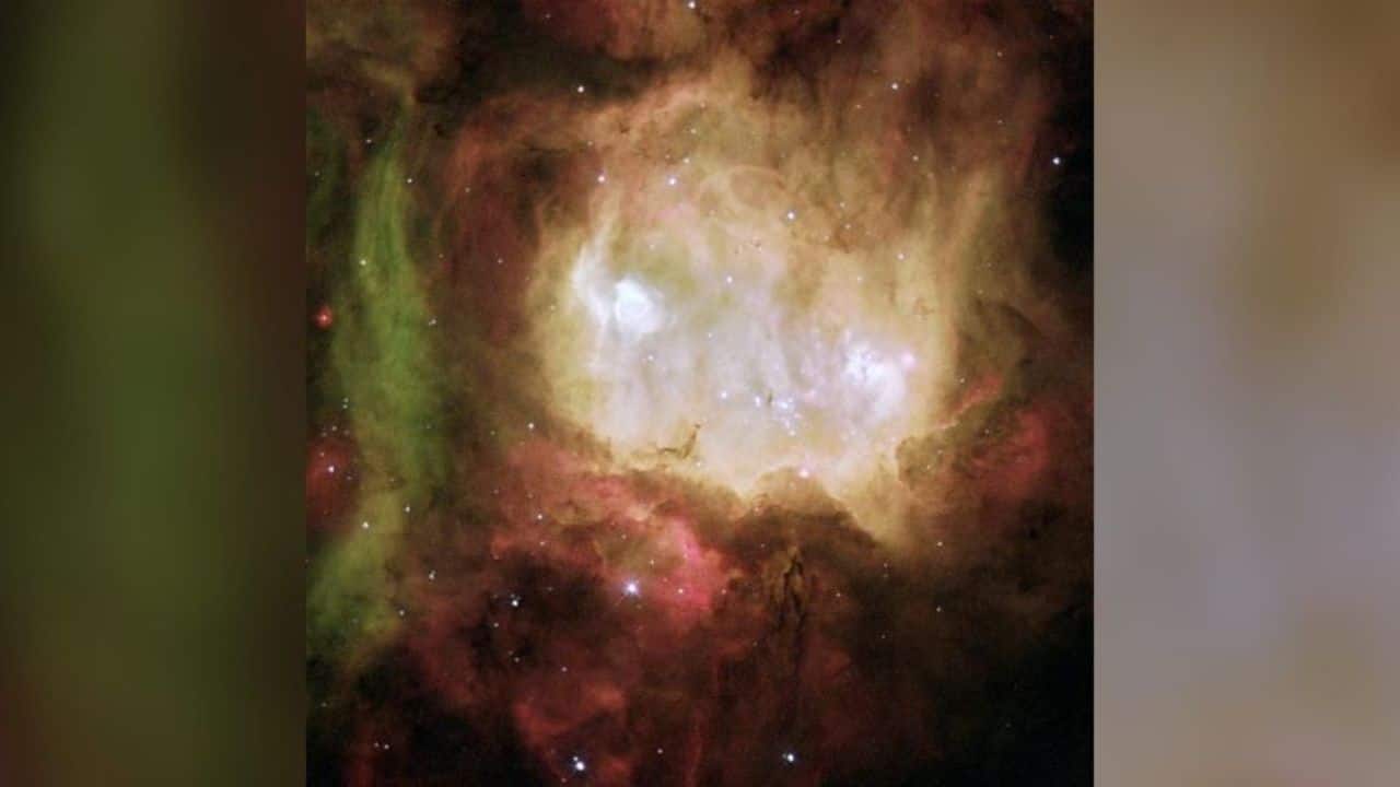 Ghost Head Nebula: The Ghost Head Nebula is a vibrant star-forming region, glowing red and green due to light emitted by hydrogen and oxygen gases. (Image: NASA)