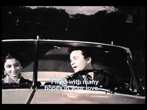 Sharmila Tagore and Uttam Kumar in a song sequence from Sesh Anka (1963).