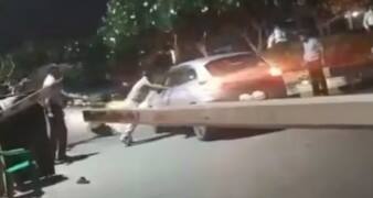 Noida man left with fractured legs after 2 men ram speeding car into crowd over parking dispute | Video