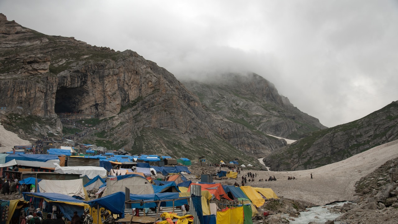Amarnath Cave Temple, Kashmir: Located at 3,888m, this sacred cave holds a natural ice Shivling. Pilgrims trek through snowy paths to witness this holy miracle. (image: canva) Amarnath Cave Temple, Kashmir: Located at 3,888m, this sacred cave holds a natural ice Shivling. Pilgrims trek through snowy paths to witness this holy miracle. (image: canva)