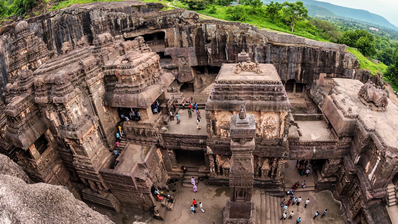 Ellora Caves, Maharashtra: This UNESCO site has 34 caves showing Hindu, Jain, and Buddhist art, built by Rashtrakutas in stunning rock-cut style. (image: canva) Ellora Caves, Maharashtra: This UNESCO site has 34 caves showing Hindu, Jain, and Buddhist art, built by Rashtrakutas in stunning rock-cut style. (image: canva)