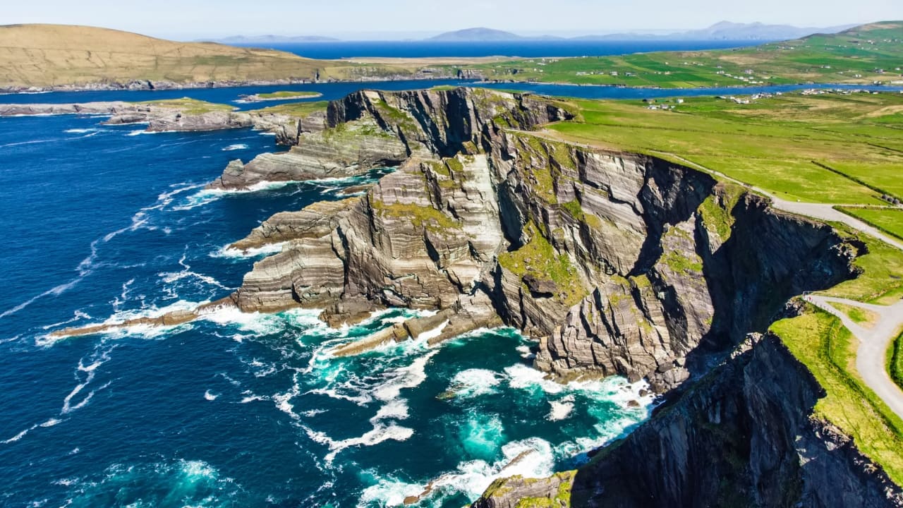 3. Ring of Kerry, Ireland: A coastal drive where folklore and wild Atlantic winds collide There’s something about the Ring of Kerry that feels like stepping into a half-remembered story. Sheep outnumber cars, waves crash against cliffs with theatrical timing, and mist clings to ancient stone forts. This isn’t just a road trip—it’s a gentle unraveling of Ireland’s rugged soul. (Image: Canva)