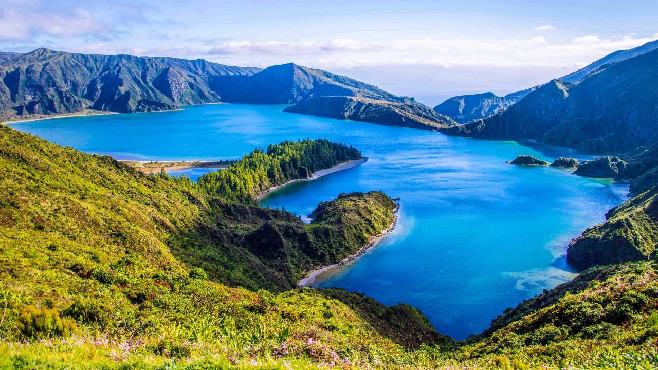4. The Azores, Portugal: Europe’s best-kept secret, hiding in plain ocean Nine volcanic islands adrift in the Atlantic—closer to America than Lisbon—yet astonishingly underexplored. The Azores offer crater lakes, geysers, and meadows blooming in surreal Technicolor. On some mornings, the only sound is a whale breaching in the distance. Yes, this is still Europe. (Image: Canva)
