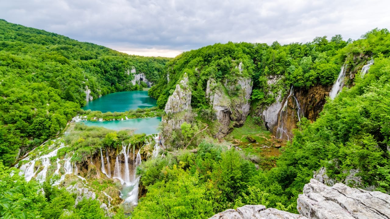 8. Plitvice Lakes National Park, Croatia: A waterfall symphony, played in turquoise Step into Plitvice and you’ll think you’ve stumbled into a dream. Sixteen lakes spill into one another over countless travertine cascades, their colours shifting with the sun. Wooden walkways wind just above the water’s surface, but the real magic is how quiet it all feels—like nature holding its breath. (Image: Canva)