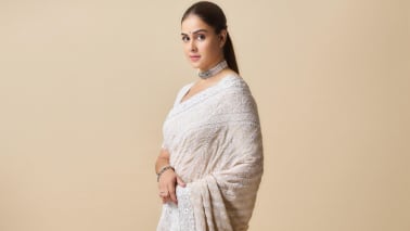 Genelia looks absolutely gorgeous in a cream embroidered saree with intricate threadwork and soft shimmer. She keeps it classic with a sleek hairstyle, a statement choker, and bangles, exuding quiet luxury and poise.