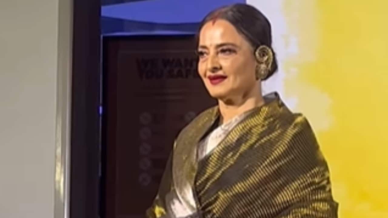 Veteran actress Rekha dazzles in a gold Kanjivaram saree. She completed her look with traditional styling, including a matching potli bag, gajra-adorned bun, and bold red lips.