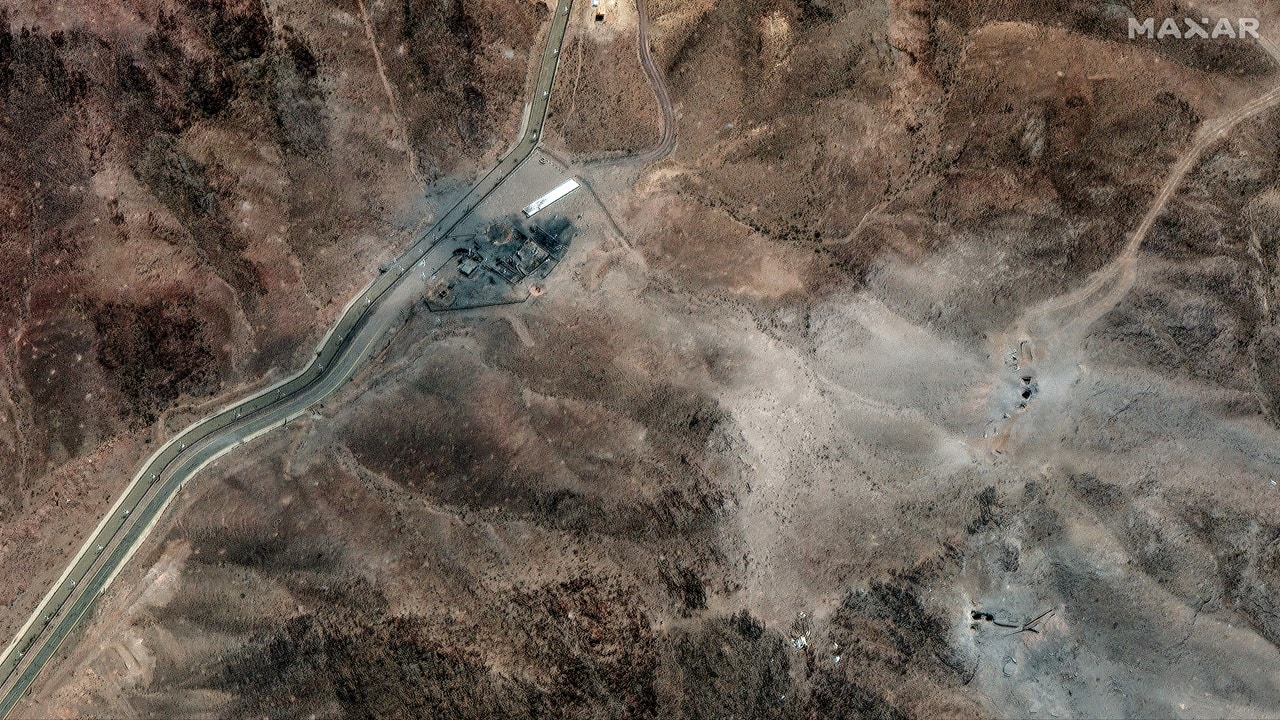 This handout satellite picture provided by Maxar Technologies shows new airstrike craters at perimeter installation on Iran's Fordow Fuel Enrichment Plant (FFEP), northeast of the city of Qom. 