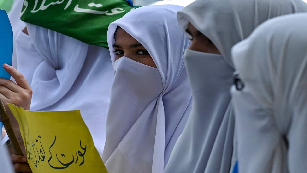 Muslim women activists of the Pakistani fundamentalist Islamic political party Jamaat-e-Islami (JI) march during a rally in Lahore on September 4, 2023, to mark the pro Hijab day (Islamic headscarf). (Photo by Arif ALI / AFP)