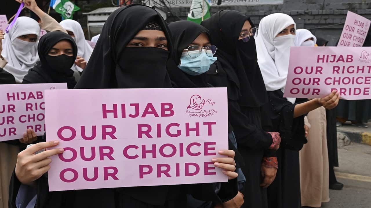 Muslim women of Pakistan's Jamaat-e-Islami (JI) party march during a rally in Lahore on September 4, 2024, to mark pro Hijab (Islamic headscarf) day. (Photo by Arif ALI / AFP)