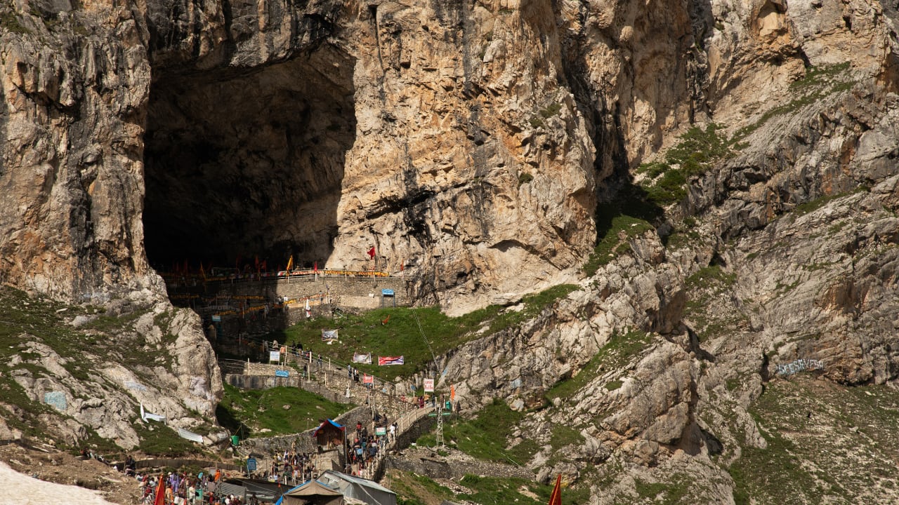 Amarnath Cave Temple, Jammu &amp; Kashmir: Situated in a high-altitude cave, this shrine houses a naturally formed ice Shivling and is accessible only during the annual yatra. (image: canva)