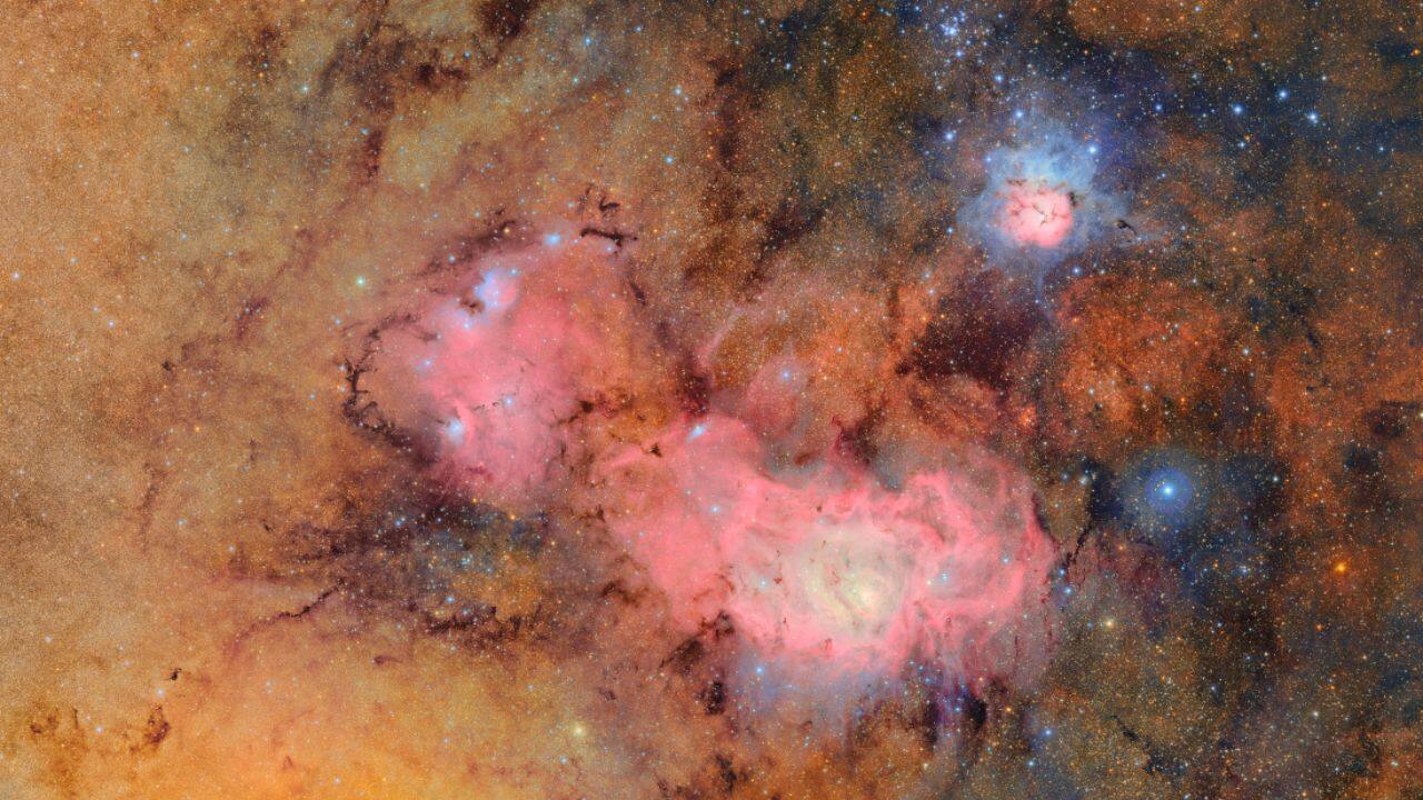 A Sagittarius Skyscape: This stunning Sagittarius skyscape from Vera C. Rubin Observatory features the Lagoon and Trifid Nebulae, showcasing star clusters, glowing gas, and dust across 4 degrees of the Milky Way’s core. (Image: Vera C. Rubin Observatory/NASA)