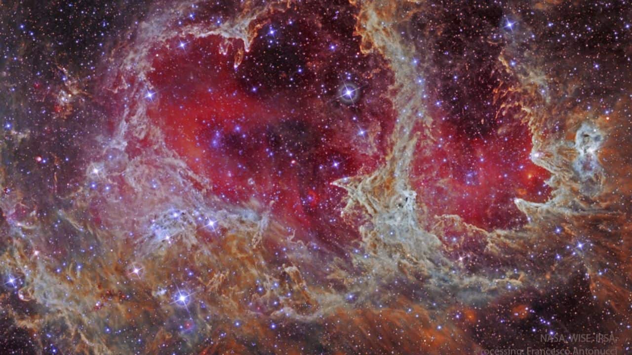 W5: Pillars of Star Formation: W5, part of the Heart and Soul Nebulas, shows star formation triggered by older stars. Hot gas compresses cooler gas into pillars, forming new stars 6,500 light-years away in Cassiopeia. (Image: NASA)