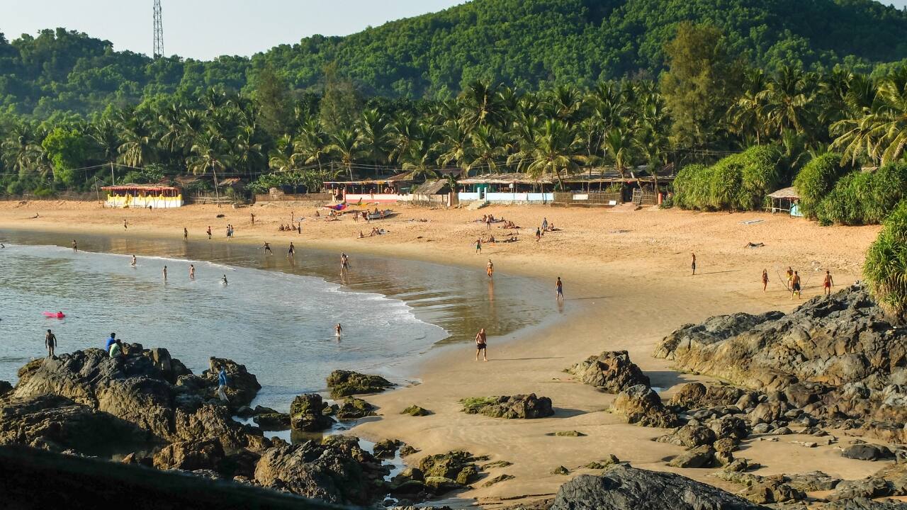 3. Om Beach – Gokarna, Karnataka Named for the sacred syllable it resembles from above, this beach invites the unhurried. The path to it is carved in dust and stone. The reward: gentle waves, arched coves, and silence enough to hear your thoughts. (Image: Canva)