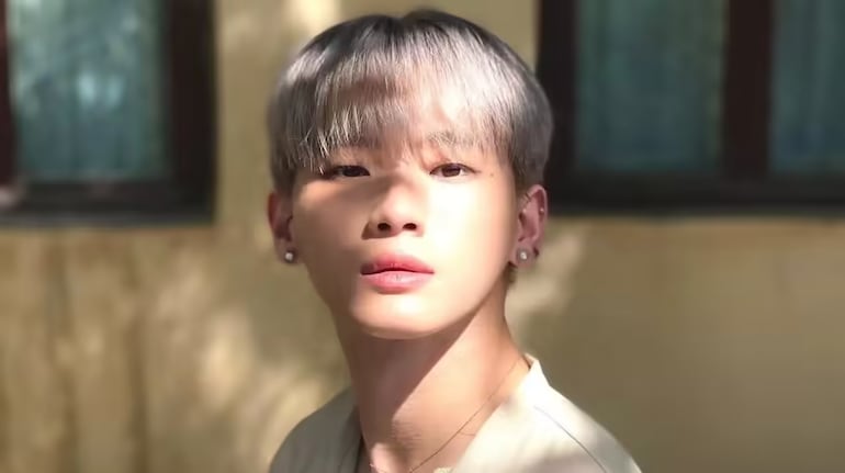 A serene moment captured, revealing the contemplative side of Jaehyun amidst the pressures of stardom.