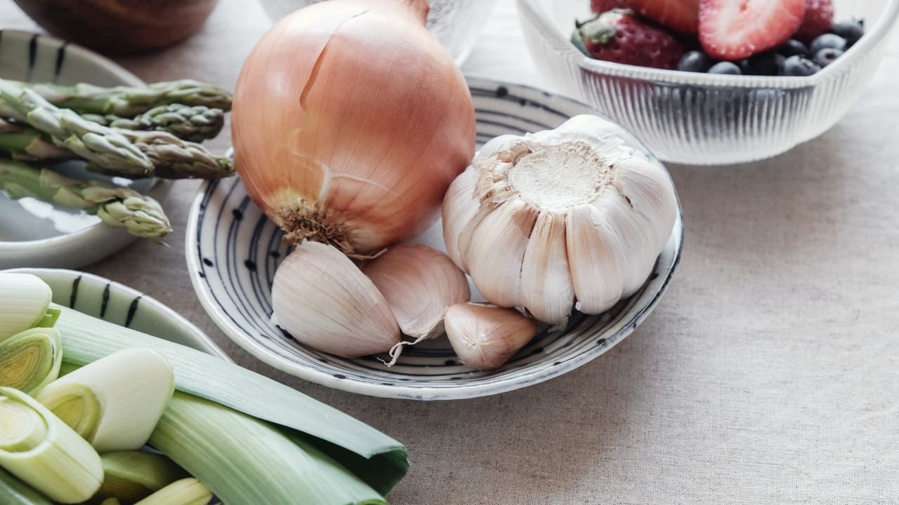 Support immunity Your gut microbes are in constant contact with your immune system. Their by-products, like SCFAs, help regulate immune responses and promote tolerance to harmless substances. Include immune-supporting foods like garlic, onions, asparagus, leeks, and fermented foods like miso and yoghurt. These encourage the growth of bacteria that work closely with immune cells to keep gut inflammation in check (Image: Canva)